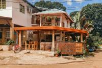 a building with a restaurant with tables and chairs at Sunset Catalina in Santa Catalina