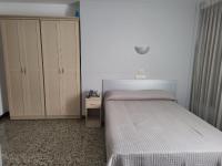 A bed or beds in a room at Hotel Cogullada