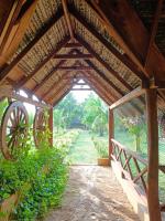 an entrance to a wooden pavilion with a wooden roof at The Tottam Beach Hotel - Trincomalee in Trincomalee