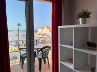 a room with a balcony with a table and chairs at Apartamento Gaviotas Sureñas in Tarifa