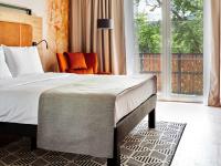 Posteľ alebo postele v izbe v ubytovaní Hotel Bergo Resort & SPA
