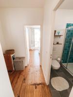 a bathroom with a shower and a wooden floor at Gritxu Etxea in Biarritz