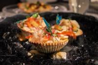 a plate of food with cupcakes on a table at Tibisay Hotel Boutique Mérida in Mérida