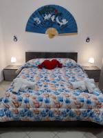 Łóżko lub łóżka w pokoju w obiekcie Etna Bella Home