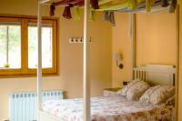 Postel nebo postele na pokoji v ubytování Els Apartaments del bosc