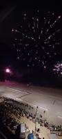 a group of cars parked in a parking lot with fireworks at Appartement Blankenberge Zeedijk aan de Pier in Blankenberge