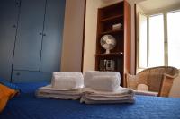 A bed or beds in a room at DOMUS - DORMIRE A VEROLI - casa vacanza b&b