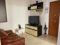 Televízia a/alebo spoločenská miestnosť v ubytovaní Via Bovio Guest House