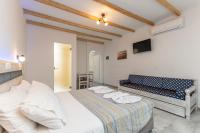 Posteľ alebo postele v izbe v ubytovaní Agios Prokopios Hotel