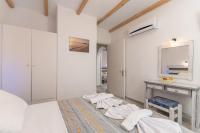Posteľ alebo postele v izbe v ubytovaní Agios Prokopios Hotel