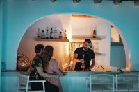 a group of people standing in a kitchen at Infinity Blue Boutique Hotel Astypalaia in Astypalaia Town