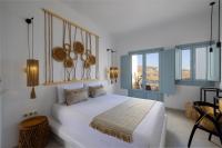 Posteľ alebo postele v izbe v ubytovaní Infinity Blue Suites & Spa