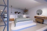 Posteľ alebo postele v izbe v ubytovaní Infinity Blue Suites & Spa