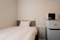 HOTEL R9 The Yard 四国中央にあるベッド