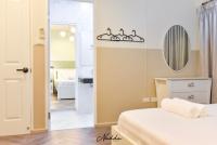 Postel nebo postele na pokoji v ubytování Nadda Pool Villa Ranong