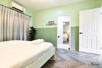 Postel nebo postele na pokoji v ubytování Nadda Pool Villa Ranong