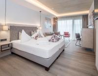 Posteľ alebo postele v izbe v ubytovaní Aktiv Hotel Schweizerhof Kitzbühel