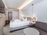 Posteľ alebo postele v izbe v ubytovaní Aktiv Hotel Schweizerhof Kitzbühel