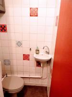 a small bathroom with a toilet and a sink at Le Passe-Port pour Marseille in Marseille