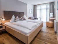 Posteľ alebo postele v izbe v ubytovaní Aktiv Hotel Schweizerhof Kitzbühel
