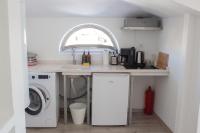Kuchyň nebo kuchyňský kout v ubytování Aloha Suites
