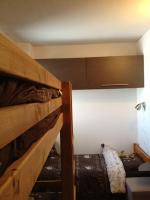 Łóżko lub łóżka w pokoju w obiekcie Menuires, Beau duplex 8 personnes, Ski aux pieds