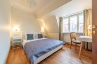 Postel nebo postele na pokoji v ubytování Old Town - Hall Square Apartment
