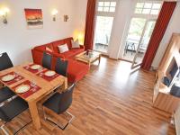 TV a/nebo společenská místnost v ubytování Villa Strandidyll Wohnung 9