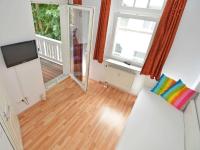 TV a/nebo společenská místnost v ubytování Villa Strandidyll Wohnung 9