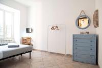 A bed or beds in a room at Casa Futura Trastevere