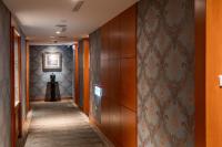 a hallway with wood paneled walls and a hallway with a hallway at Elegance Hotel in Taipei