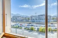 a window with a view of a parking lot at Le Bouvard - MyCosyApart, Central Gare 100m, Netflix in Annecy