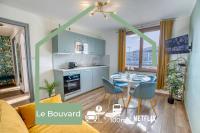 a kitchen and living room with a table and chairs at Le Bouvard - MyCosyApart, Central Gare 100m, Netflix in Annecy
