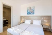 Posteľ alebo postele v izbe v ubytovaní Bella Karpathos Villas