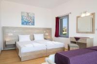 Posteľ alebo postele v izbe v ubytovaní Bella Karpathos Villas