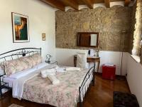 A bed or beds in a room at B&B QUINTARELLI