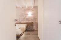 A bed or beds in a room at Modern & Stylish Apartment in Como City by Rent All Como