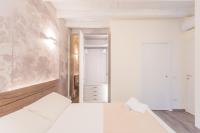 A bed or beds in a room at Modern & Stylish Apartment in Como City by Rent All Como