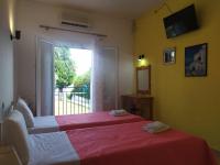 Postel nebo postele na pokoji v ubytování Eva Apartments