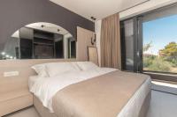 Posteľ alebo postele v izbe v ubytovaní Luxury Villa Hera