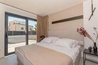 Posteľ alebo postele v izbe v ubytovaní Luxury Villa Hera