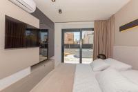 Posteľ alebo postele v izbe v ubytovaní Luxury Villa Hera