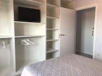 A bed or beds in a room at Albatros (wifi y garaje)