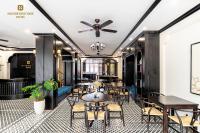 a restaurant with tables and chairs and a ceiling at Nature Boutique Hotel - Nguyen Thi Nghia in Da Lat