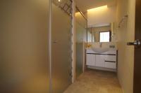 a bathroom with a shower stall and a sink at Taitung Venice B&amp;B in Taitung City