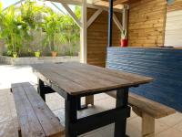 a wooden picnic table sitting on a patio at Yeux D&#39;azur in Le Souffleur