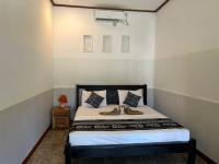 Kuta Circle Homestayにあるベッド