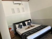 Kuta Circle Homestayにあるベッド