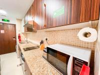 Kuchyň nebo kuchyňský kout v ubytování Cosmos Living Modern Studio Near Dubai Marina