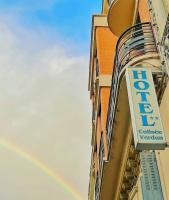 a store sign with a rainbow in the sky at Hôtel Colisée-Verdun Centre Gare Saint-Roch in Montpellier